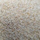 Close-up of a mound of pale beige sand grains
