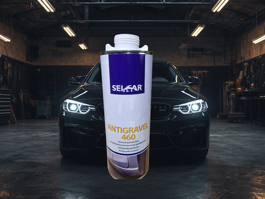 Bas de caisse auto en arrière-plan 2 - PredaColor Tall white and purple spray can labeled 'Antigravel 460' in front of a dark car in a workshop.