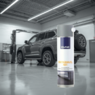 Bottle of Antigravel 461 stonechip protection in a car workshop with a gray SUV in the background.