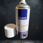 Retirer larrière-plan de limage - PredaColor White aerosol spray paint can with a blue label, cap removed, set against a dark textured background.