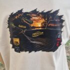 3 1 DOS - PredaColor Graphic on a white T-shirt: an alligator figure with the word GATOR on its hat and clothing, beside a pickup truck at sunset.
